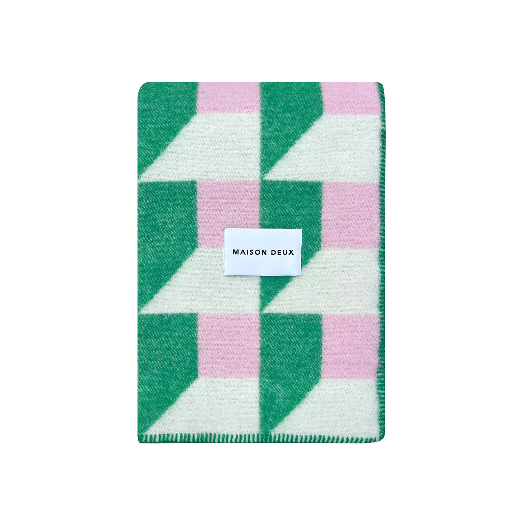 Maison Deux Cubics Blanket in grass and pink, reversible wool throw with cubic pattern and fringed edges, oversized for cozy lounging.