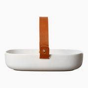 Koppa Serving Dish by Marimekko in white stoneware with a removable natural leather handle.