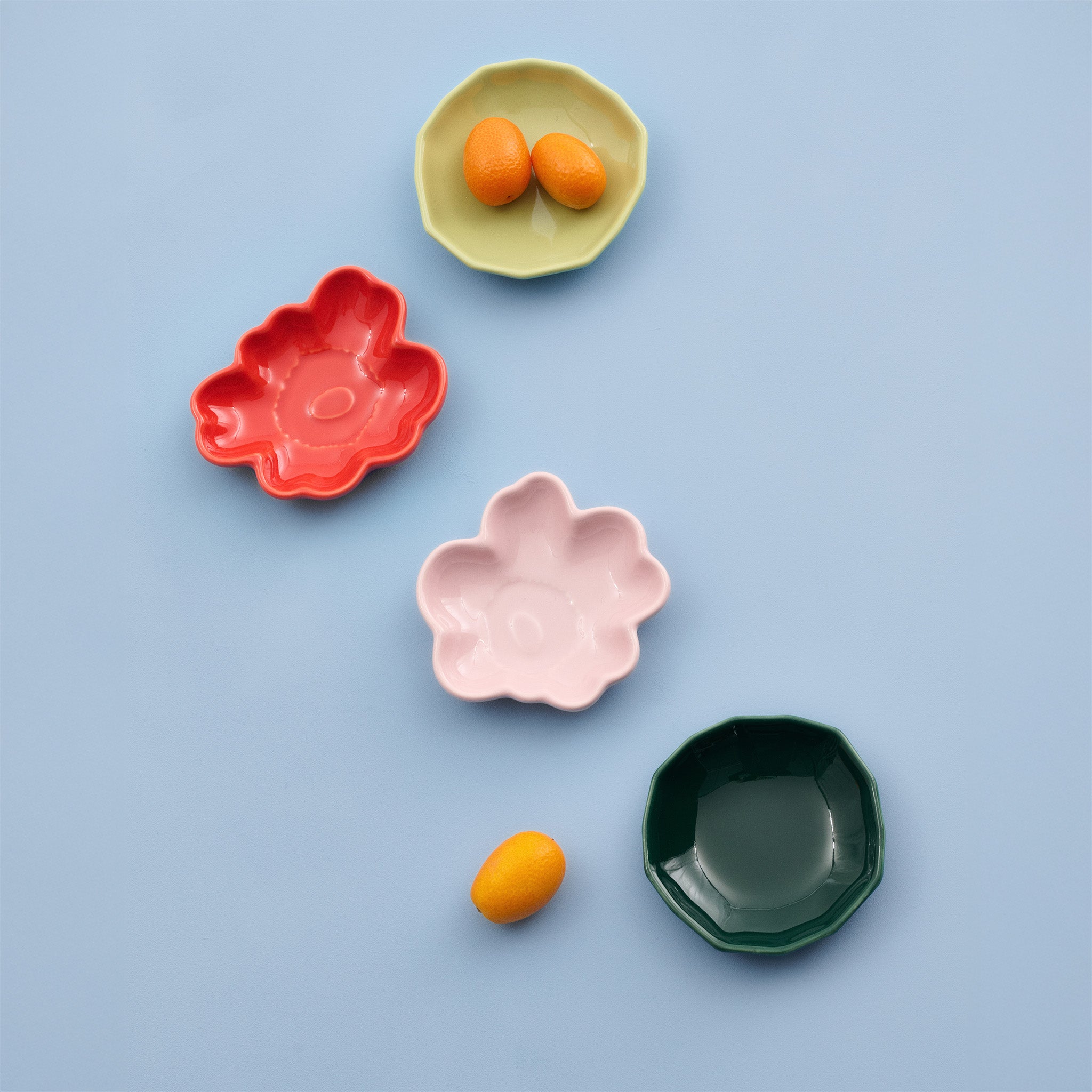 Marimekko Unikko and Kivet mini plate set with colorful flower and stone shaped ceramic plates in box.
