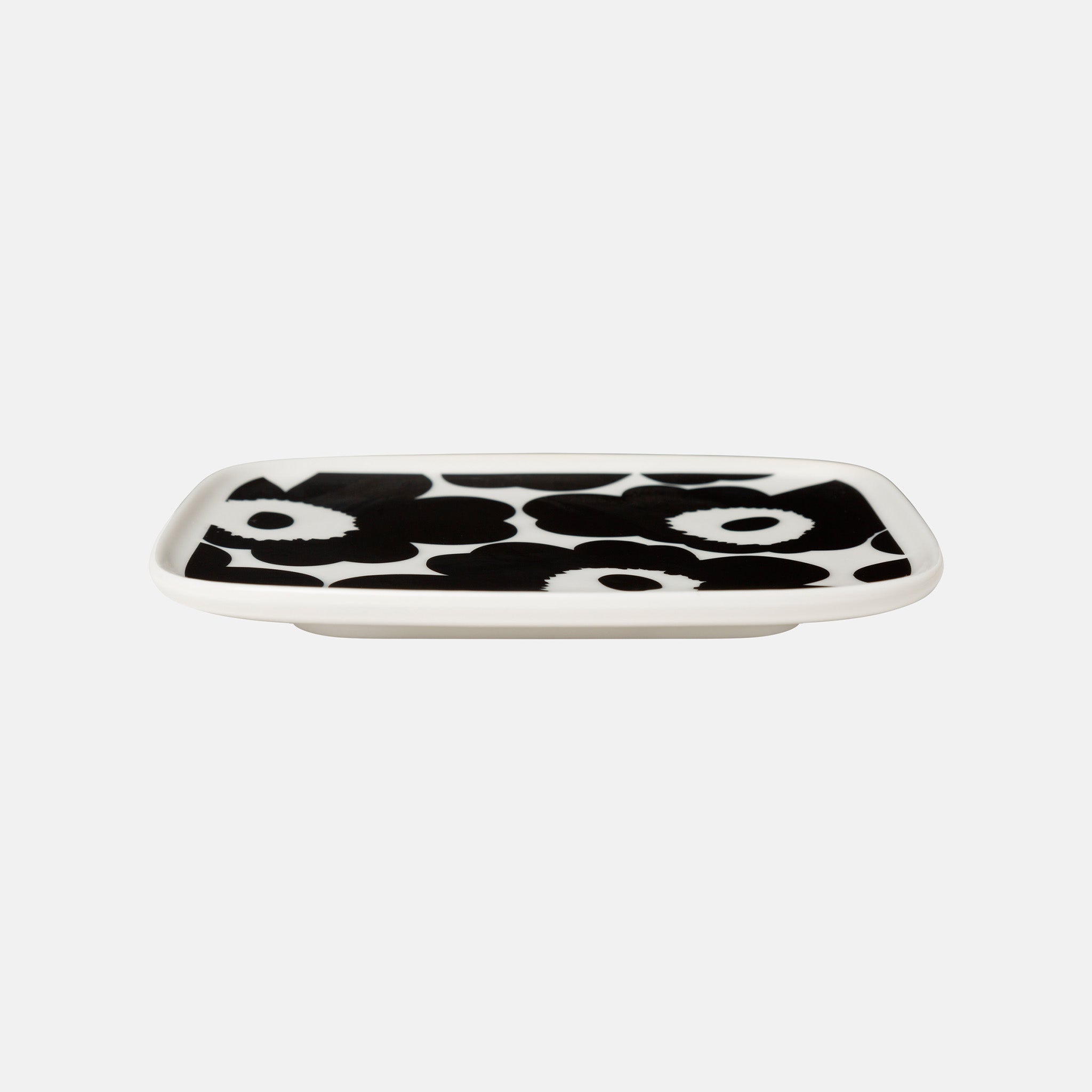 Marimekko Oiva / Unikko rectangular plate in black and white poppy pattern designed by Maija Isola.