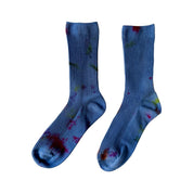Painters Hand-Dyed Dressy Socks by Merle Works featuring blue ribbed cotton with scattered green, purple, and pink paint-like speckles inspired by a French painter's workwear.