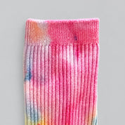 Pink Lemonade Ice-Dye Dressy Socks by Merle Works featuring ribbed cotton with vibrant pink, coral, orange, yellow, and blue watercolor-like patterns created through hand ice-dyeing.