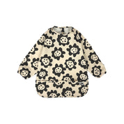Long sleeve smock bib in six artist-designed colorways. Waterproof, recycled fabric, fits 6 months–3 years—extra coverage for mealtime and crafts.
