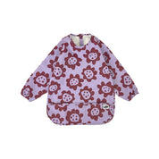 Long sleeve smock bib in six artist-designed colorways. Waterproof, recycled fabric, fits 6 months–3 years—extra coverage for mealtime and crafts.
