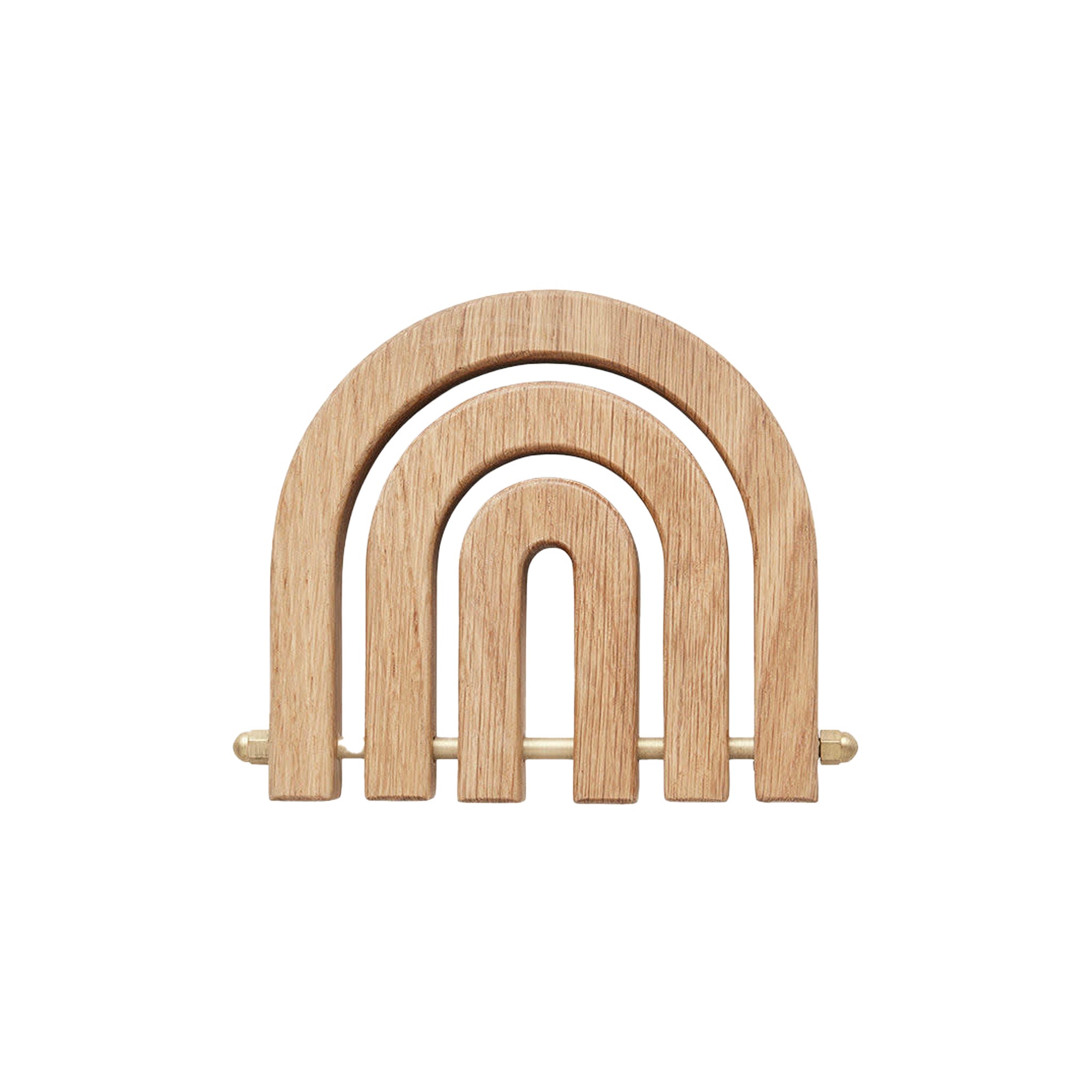 OYOY Living Design Rainbow Wooden Trivet in oak with brass details. Foldable rainbow shape expands for hot pots or hangs as wall décor.