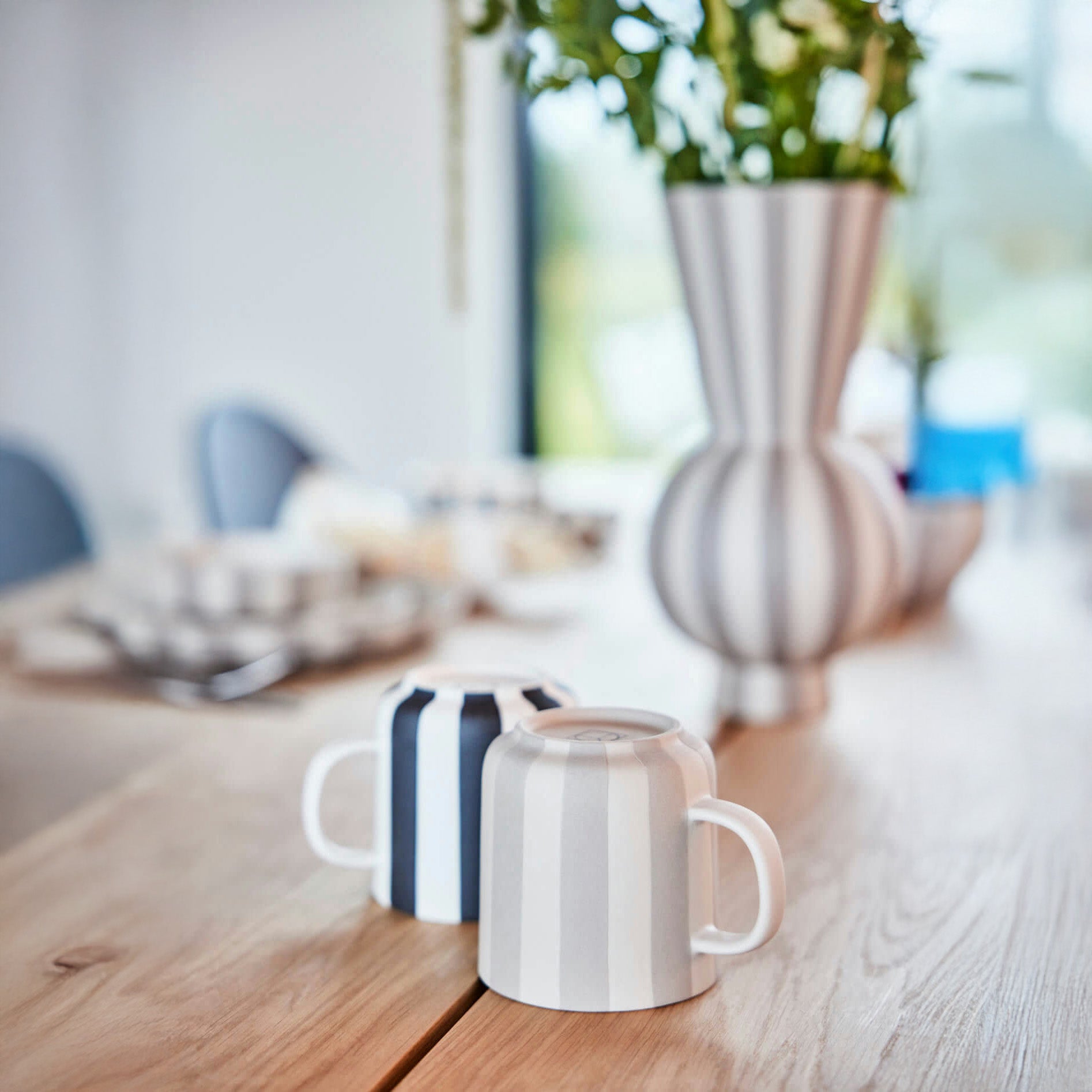 Toppu Mug by OYOY Living Design in hand-painted stoneware stripes, handmade and dishwasher safe, available in multiple colors.