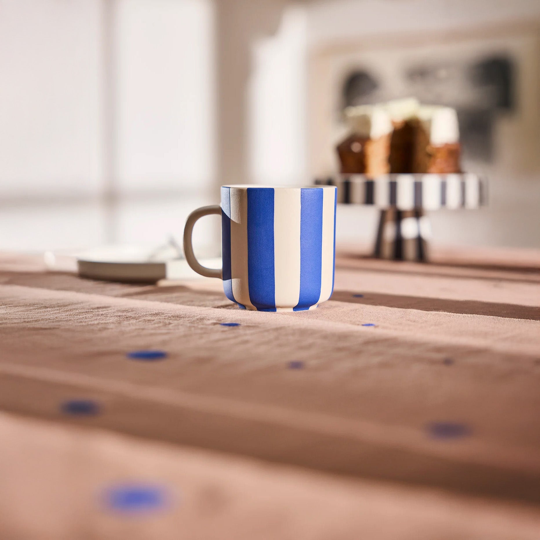 Toppu Mug by OYOY Living Design in hand-painted stoneware stripes, handmade and dishwasher safe, available in multiple colors.