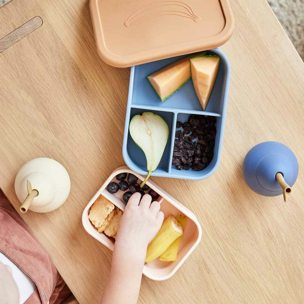 OYOY Yummy Lunch Box in silicone with Yummy print, three compartments for snacks and lunches.