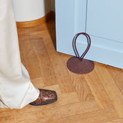 Pidät STOP round speckled rubber doorstop with recycled polyester rope, designed by Studio Gorm and made in Portugal.