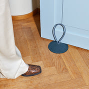 Pidät STOP round speckled rubber doorstop with recycled polyester rope, designed by Studio Gorm and made in Portugal.
