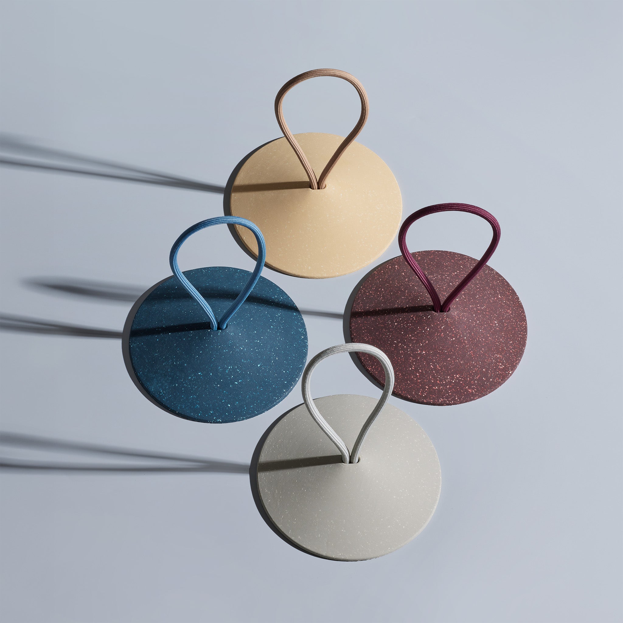 Pidät STOP round speckled rubber doorstop with recycled polyester rope, designed by Studio Gorm and made in Portugal.