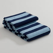 Stripe Towel by RATIA in tonal blue or green stripes, made from 100% cotton.