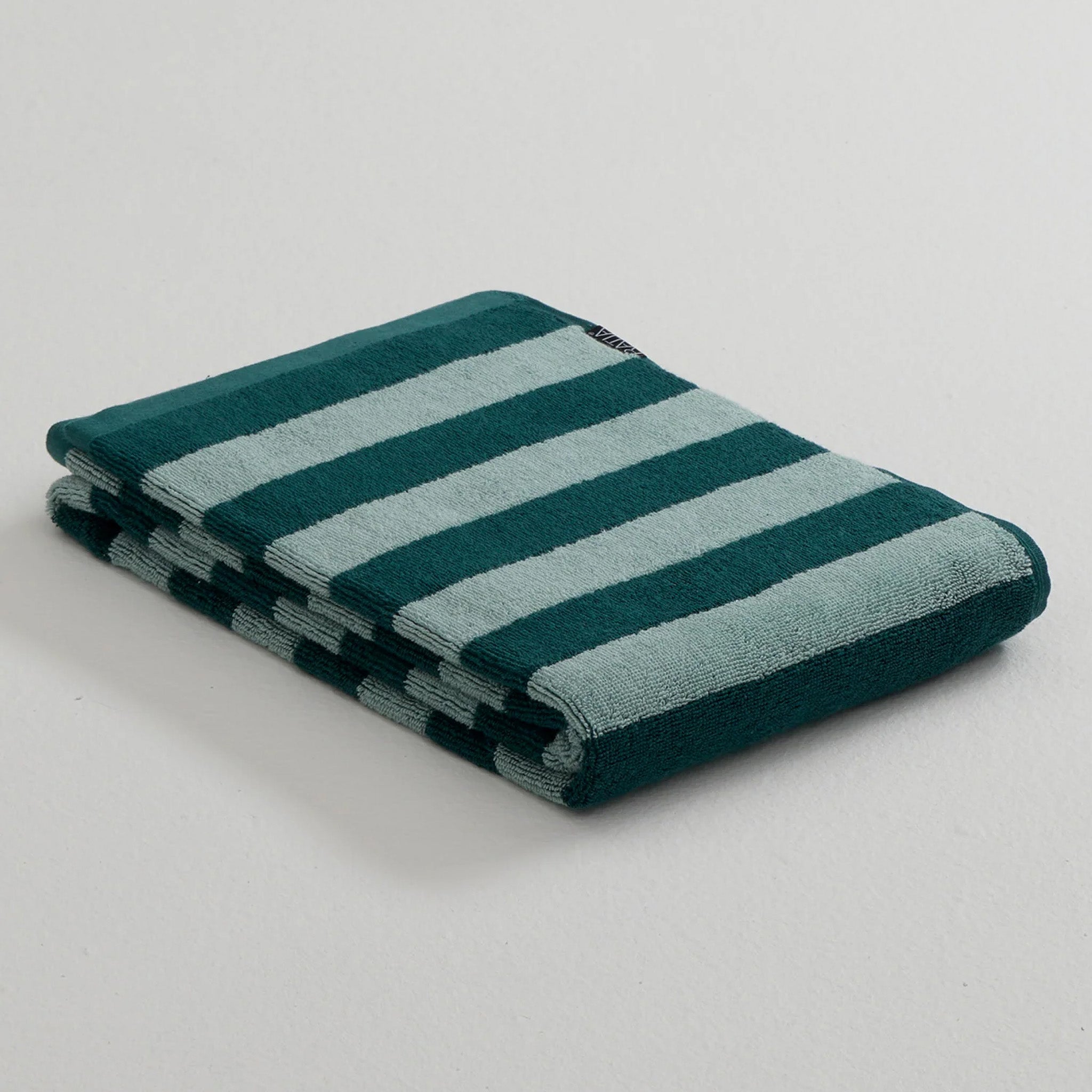 Stripe Bath Towel by RATIA in tonal blue or green stripes, made from 100% cotton.