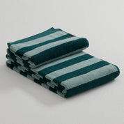 Stripe Towel by RATIA in tonal blue or green stripes, made from 100% cotton.