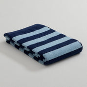 Stripe Bath Towel by RATIA in tonal blue or green stripes, made from 100% cotton.