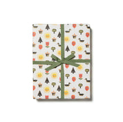 Red Cap Cards For You Gift Wrap, illustrated by Jon Klassen. Gift wrap with quirky trees, flowers, and balloons with eyes. Recycled paper, set of 3 rolled sheets, 19 × 27 inches.