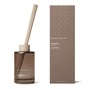 Skandinavisk Hygge 200ml scent diffuser in painted glass bottle with wooden ring and reeds.