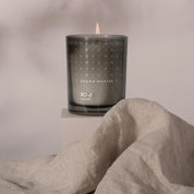 Skandinavisk Ro Scented Candle inspired by Scandinavian tranquility with fresh green notes of cut grass, cucumber, wild violets, and fallen leaves.