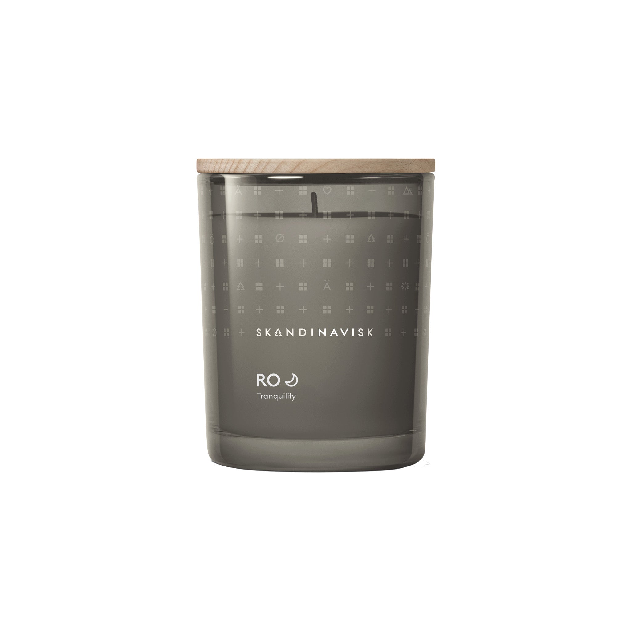 Skandinavisk Ro Scented Candle inspired by Scandinavian tranquility with fresh green notes of cut grass, cucumber, wild violets, and fallen leaves.