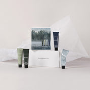 Skandinavisk Wood & Water Hand Cream Gift Set with four 30 ml hand creams in SKOG, FJORD, ØY, and HAV fragrances.