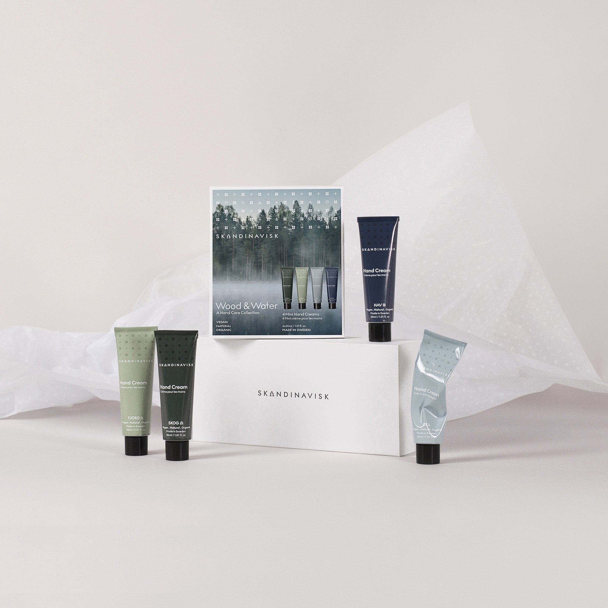 Skandinavisk Wood & Water Hand Cream Gift Set with four 30 ml hand creams in SKOG, FJORD, ØY, and HAV fragrances.