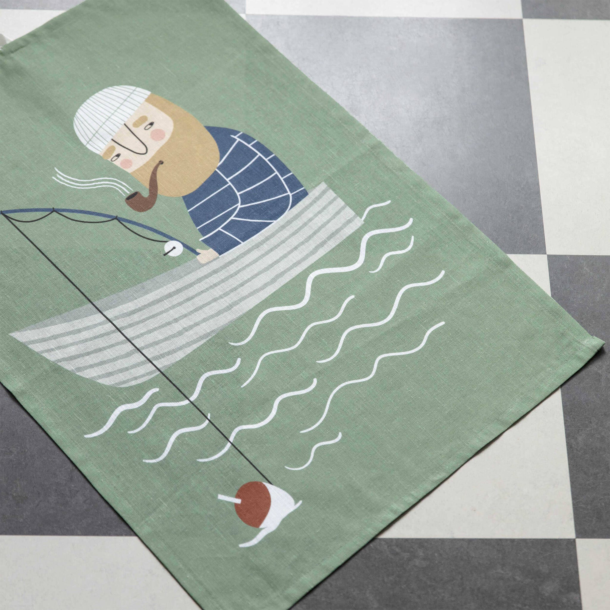 Ebbot Kitchen Towel by Spira of Sweden featuring a whimsical illustrated character on a natural linen-cotton blend towel, designed for drying dishes and adding Scandinavian charm to the kitchen.