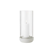 Stelton Hurricane Candleholder Small in sand stoneware with glass shade, weather-resistant for indoor or outdoor candlelight.