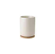 Stelton Theo Thermo Cup with bamboo coaster, available in matte black or sand stoneware with glossy interior, designed by Francis Cayouette. 0.25 L Nordic mug.