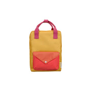 Sticky Lemon Envelope Backpack in colorful recycled fabric with front zip pocket, waterproof lining, and adjustable shoulder straps. Available in Small, Medium, and Large.