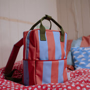 Sticky Lemon Stripes Backpack in colorful striped recycled fabric with front zip pocket, waterproof lining, and adjustable shoulder straps in Medium and Large.