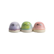 Dot by Studio Arhoj handmade porcelain figurines in purple, green, and pink glazes with expressive eyes.