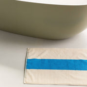 Aqua Dark Green Bath Mat by SUITE702 in aqua, dark green and cream with a reversible graphic design.