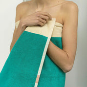 Red Turquoise Bath Towel by SUITE702 with graphic red and turquoise color-block design.