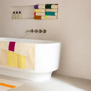Yellow Fuchsia Bath Towel by SUITE702 with graphic yellow and fuchsia color-block design.