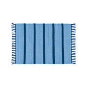 Upcycled Rug by Tarta Gelatina with colorful woven stripes and fringed ends, designed in Barcelona and handmade from upcycled cotton textiles.