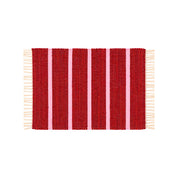 Upcycled Rug by Tarta Gelatina with colorful woven stripes and fringed ends, designed in Barcelona and handmade from upcycled cotton textiles.