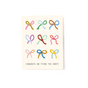 Congrats On Tying The Knot wedding card by Tender Loving Empire featuring nine colorful illustrated bows on a cream background.