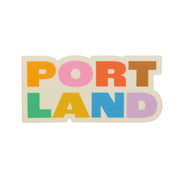 Portland Colorblock Sticker featuring bold colorful lettering spelling Portland in a modern graphic design.