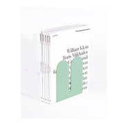 Tortuga Forma Large Bookend in cactus green solid steel, oversized arc design for supporting art books, cookbooks, or vinyl.