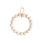 Verso Design KRANSSI Wreath Trivet in Birch with Leather loop, handcrafted Nordic bead design, usable as wreath or trivet.