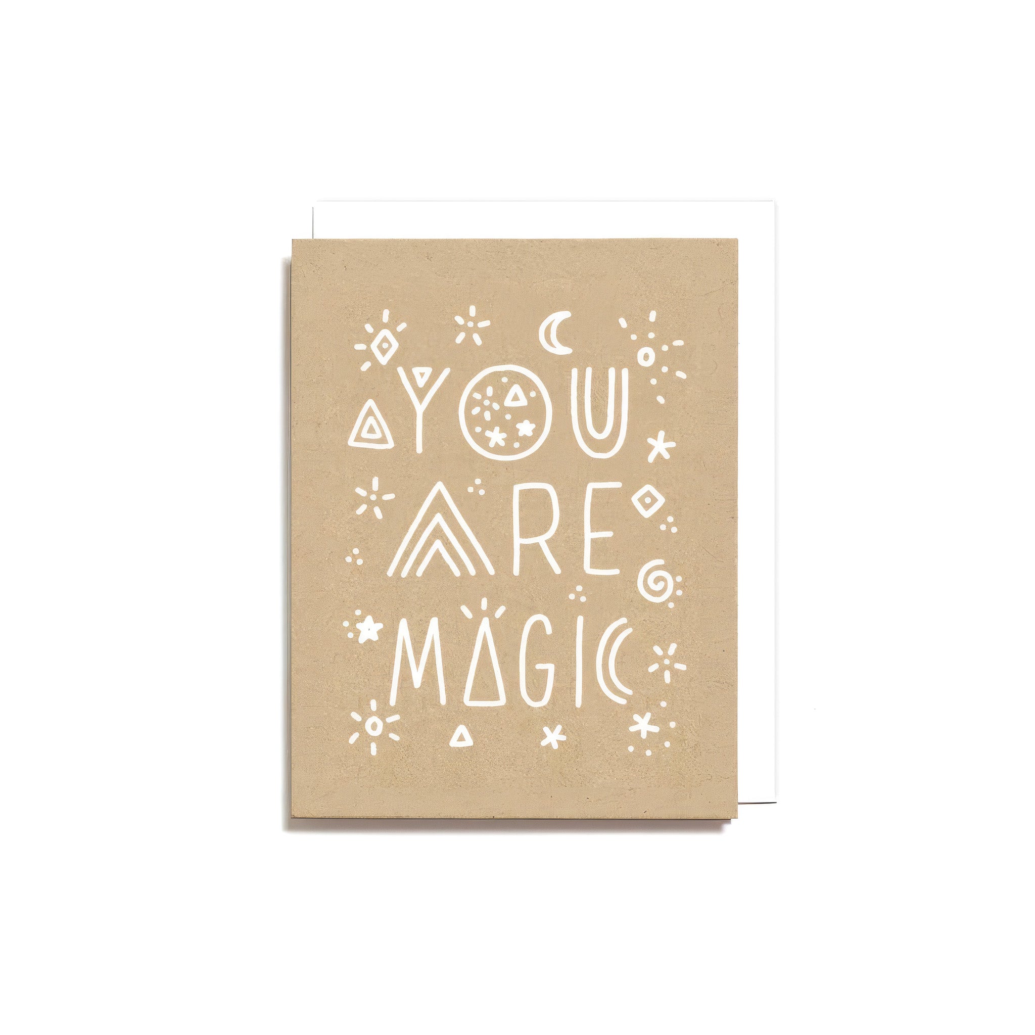Worthwhile Paper You Are Magic Card with white hand-drawn lettering, stars, moons, and geometric doodles on kraft-colored recycled cardstock.